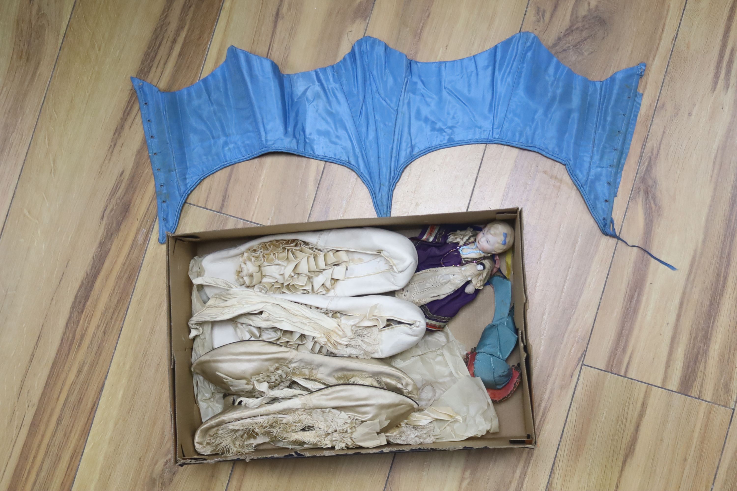 A pair of silk shoes, a corset, etc.